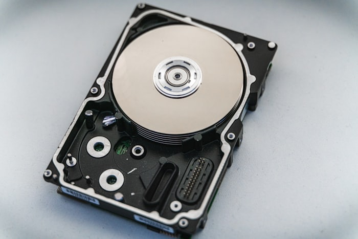 An opened hard drive being assessed for recovery